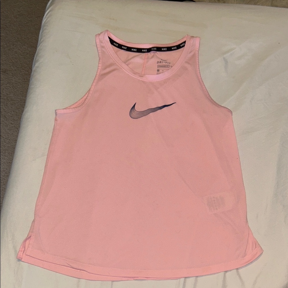 Nike Kids Light Pink Tank Top. black. XL in kids Nike is black on the front